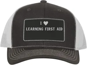 I Heart Love Learning First Aid - Leather Black Patch Engraved Trucker Hat